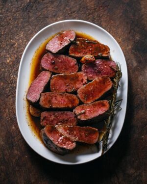 Adam Liaw Instagram - Lamb backstraps with rosemary butter. I hadn’t bought lamb backstraps in years but they were on special so I picked up a few and made this. So easy and so good. Recipe link in my profile.