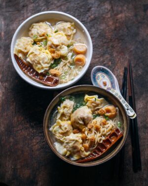 Adam Liaw Instagram - Tonight’s dinner. Pork and prawn wonton noodles. Broth made from chicken bones, dried fish and dried scallops. Finished with onion oil, braised bamboo shoots, Sarawak pepper, spring onion and chu yau char (crispy pork lard). 

I think the key with nearly all dumpling fillings is (a) working the filling to align protein filaments (I use a stand mixer with a paddle attachment), and (b) seasoning by weight (I weigh the filling and then season with 0.5% salt as a base, then adjust with other salty ingredients as needed for purpose).