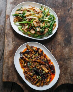 Adam Liaw Instagram - Tonight’s dinner. Yuxiang eggplant, and pork and broccolini. We talk about “one-pot wonders” but all this was cooked in one wok in less than the time it took for the rice to cook in the rice cooker (27 minutes) with plenty of time to spare. Served with a few pickles and a little bit of clear soup. 

Served on Everyday oval plates. I know it’s a small thing, but I designed this plate specifically so that dishes could be easily placed in the centre of a table to be shared. In Asian cultures dining tables are usually round, which means there’s plenty of room in the centre for sharing plates, but in Australia most of us (my family included) have rectangular dining tables so the oval plate is actually more economical on space and makes it easier to have multiple dishes in the centre.