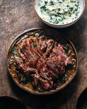 Adam Liaw Instagram - Tonight’s dinner. Scotch fillet with caramelised onion and portobello mushroom sauce. Creamed spinach. One very simple but very effective trick for pan sauces like this is that if you’re using commercial beef stock (which most of us are at home) rather than home made, commercial stocks have a lot of the gelatine removed so that it doesn’t clump in the packet at room temperature or in the fridge. The problem is that this gelatine is important for the mouthfeel of a reduced pan jus. Who hasn’t wondered why their pan sauce isn’t thickening the way it’s supposed to. Thankfully the answer is very simple, I add a half teaspoon of powdered gelatine to the sauce to improve the thickening and mouthfeel. It works wonders. 👍