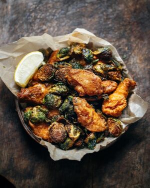 Adam Liaw Instagram - Tonight’s dinner. Fried garlic chicken wings and brussels sprouts. So good.