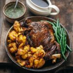 Adam Liaw Instagram - Tonight’s dinner. Sunday roast. Lamb leg, gravy, mint sauce with rosé vinegar, exceptionally good potatoes and green beans. It’s been a while since I roasted a leg of lamb, as shoulders tend to be the roast of choice for most people these days. But there’s still life in the old legs yet.