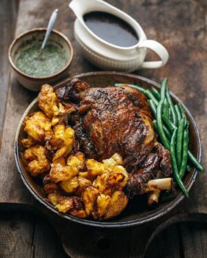 Adam Liaw Instagram - Tonight’s dinner. Sunday roast. Lamb leg, gravy, mint sauce with rosé vinegar, exceptionally good potatoes and green beans. 

It’s been a while since I roasted a leg of lamb, as shoulders tend to be the roast of choice for most people these days. But there’s still life in the old legs yet.