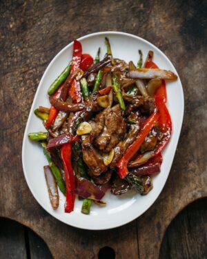 Adam Liaw Instagram - Tonight’s dinner. Beef, asparagus and capsicum with oyster sauce.

Stir-frying is all about technique, but that's not to say that it's difficult. I've changed the way I stir-fry over the years to make things more efficient for home cooking.

While restaurant cooking usually fries or oil-blanches the meat first, for home cooking I think it's better to cook the vegetables first and then remove them from the wok to fry the meat second, returning the vegetables to the meat later. This avoids the need to wash the wok if any meat sticks to the metal (which it usually shouldn't).

This recipe fries the asparagus, capsicum and onion first, then the beef second, tossing everything together with simple seasonings of oyster sauce, soy sauce, wine and sugar.

Recipe link in my profile.