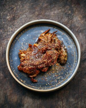 Adam Liaw Instagram - Tonight’s dinner. Sichuan lamb shoulder. Lamb shoulder cooked for 5 hours, then stripped off the bone and tossed in a sweet doubanjiang glaze then covered with a mixture of roasted fennel seed, cumin, Sichuan peppercorn, chilli and nori. This was soooo good.