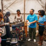 Adam Liaw Instagram - This is the UNICEF-supported #GreenGirls initiative where young women from #Sobel produce ecological charcoal from collected waste. We often think of the effects of climate change first impacting low-lying island nations, but #Sobel is a camp for more than 6000 Burundians who have been displaced because of extreme flooding caused by climate change. Climate change is already having a big impact on Burundi, from increasing frequency of extreme weather events like flooding, to decreased agricultural yields caused by prolonged rainy seasons. The Green Girls program an ingenious multi-dimensional solution to may of the problems facing these climate refugees. Firewood collection is a task usually performed by young women, who may have to walk for hours to find appropriate firewood. This exposes them to a high risk of sexual assault, and firewood collection contributes to deforestation. By producing ecological charcoal the girls don’t have to search for firewood, protecting them from potential assaults, and it also reduces deforestation and provides them with an additional source of income from the sale of surplus charcoal. An ingenious solution to a multi-dimensional problem. It was fabulous to see this initiative first-hand, chat with the girls and play with many of the kids from Sobel.