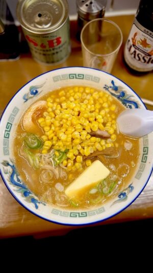 Adam Liaw Instagram - First meal in Sapporo. Corn butter Sapporo ramen from Tenhou. Sapporo is famous for miso ramen, often adding Hokkaido specialties (like corn and butter). My advice for ramen in Japan is to pay attention to all the details. In this case the things that stood out for me were the thickness of the spring onion, the fact that it was served with two different types of black pepper for seasoning (Gaban and S&B), the lightness of the miso tare and the springy texture of the noodles.