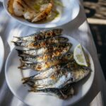 Adam Liaw Instagram - Spanish yum cha? Visiting my brother who lives in a village just outside Malaga. Seaside restaurants right on the beach serving seafood grilled over hot coals. Waiter walk around with the plates and you just grab what passes you by. The bill is tallied up at the end and written straight on the paper lining the table. With a few glasses of tinto de verano it’s the best way to spend a warm afternoon. El Tintero, El Palo