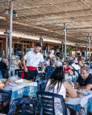 Adam Liaw Instagram - Spanish yum cha? Visiting my brother who lives in a village just outside Malaga. Seaside restaurants right on the beach serving seafood grilled over hot coals. Waiter walk around with the plates and you just grab what passes you by. The bill is tallied up at the end and written straight on the paper lining the table. With a few glasses of tinto de verano it’s the best way to spend a warm afternoon.