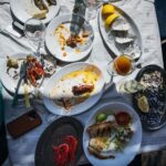 Adam Liaw Instagram – Spanish yum cha? Visiting my brother who lives in a village just outside Malaga. Seaside restaurants right on the beach serving seafood grilled over hot coals. Waiter walk around with the plates and you just grab what passes you by. The bill is tallied up at the end and written straight on the paper lining the table. With a few glasses of tinto de verano it’s the best way to spend a warm afternoon. El Tintero, El Palo