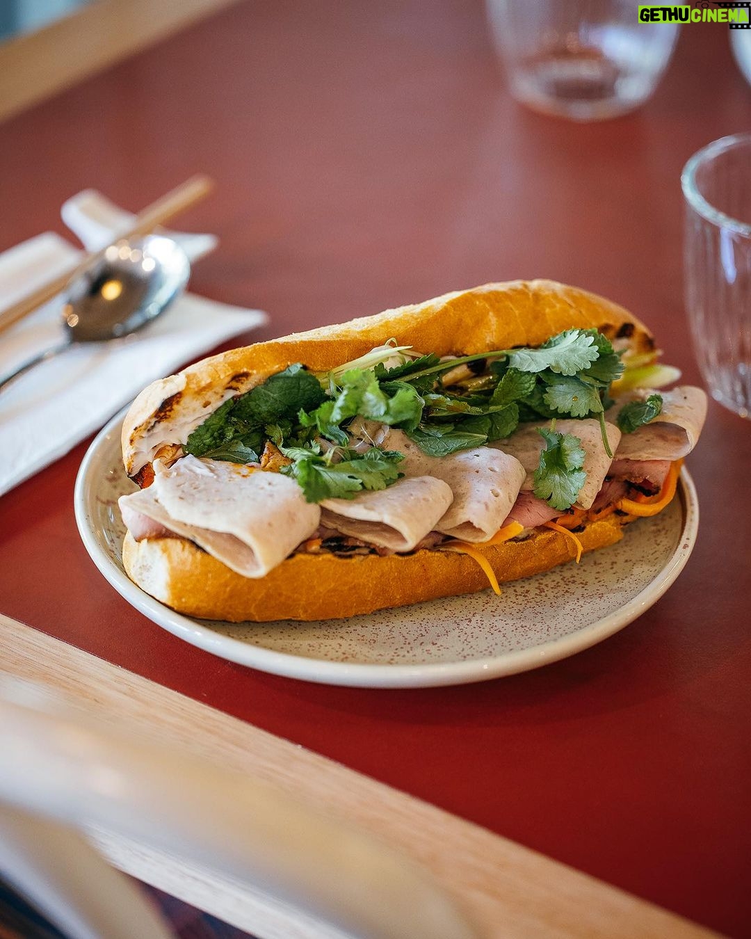 Adam Liaw Instagram - Our final episode of #AdamandPoh’s Great Australian Bites starts very soon on @sbsfood and we’re exploring @visitcanberra’s amazing food scene and FINALLY answering the question of what is Australia’s national dish? We eat what might be Australia’s best banh mi, make a pretty incredible bacon and egg roll, and put on the best sausage sizzle the country has ever seen, before having the results of our national dish poll read by a very special guest! …. … 🚨 It’s the Prime Minister. The special guest is the Prime Minister. 🚨 #visitcanberra