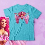 Alex Gracia Instagram - Who’s just as excited for @barbiethemovie as much as I am? Well in celebration for one of my biggest inspirations I created a “The Pink Dream is Pretty Everything” movie cover inspired shirt! 👚 Link in Bio -> Alex Gracia T-Shirts