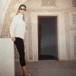 Alex Meneses Instagram - #tbt This photo was taken in Bahrain, The Kingdom of Bahrain. It’s a very beautiful place. I’m standing in front of a Mosque that was built more than 2,000 years ago. I was not allowed to go into the Mosque or to go across the bridge to Saudi Arabia. I was there for a modeling job. They needed someone to represent Kotex sanitary pads. Seriously. They needed someone who could look Arabic, but not too Arabic. I never understood what that meant, but it felt insulting. There were alot of girls who were afraid to go. I wasn’t. Travel was the thing I loved most about modeling. I remember my collarbone and forearms had to be covered at all times and they discouraged walking around without my father or husband. When the advertising agency found out I was walking around the city alone, they sent a car to look for me. They found me and everything was fine. It was an amazing and eye opening experience. I loved it but I don’t think I would want to go back. #babyalex #model