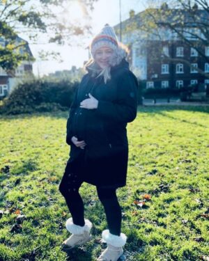 Ali Bastian Instagram - 30 weeks today!! 🤰🏼 #bumpdate Feeling ready to fully enter hibernation mode, especially with this cold weather - two year old has other ideas!  In some ways it’s probably not the worst thing that she is helping me stay reasonably active. I’m still managing my Gestational Diabetes with diet - although never sure how long that will be for - I’m trying to not be too attached to the idea I can ‘control’ it and accept that if I need medication then that’s what I will do to keep me and bubba safe. Keeping moving more than I did in first pregnancy has got to be a good thing though! It’s hard to not be able to eat what I feel like - which honestly, most of the time is cake!! I miiiisssss caaaake!! And chocolate and crisps and did I mention cake??? Also top tip for anyone else preggo in this cold weather.. @seraphinematernity do this fleece lined set of thermals that I got a few weeks back when I was filming outside all day! 🎬❤️And their 3 in 1 Maternity to baby wearing parka is a faux fur lined dream that comes with an extra panel for baby wearing with a little hood. I was a big baby wearer with Isla and really hope to carry our new bubba! Swipe for frosty photo dump! 💜 #thirdtrimester #pregnancy #bump #gift