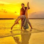 Ali Bastian Instagram - #internationaldanceday today apparently! I dedicate it it you @davidcomahony, the man I’ve seen more sunrises with than I ever imagined possible! ❤️👶🏼😂May there be more high kicks on beaches and even more silly kitchen salsa. I love you my partner in crime and dancing ❤️ 📸: @eliyz_gallery Location: Our honeymoon. The Maldives 💫