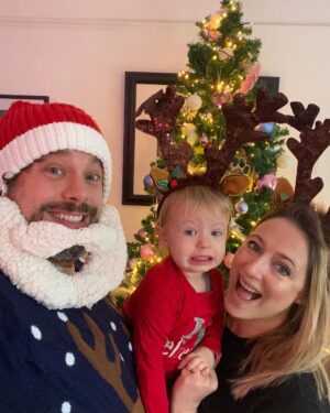 Ali Bastian Instagram - Christmas Photo Dump!!! 🎄🎄🎄 We felt so incredibly lucky to be able to share Christmas with my family given the absolute hellish lottery of the Covid situation at the moment. D had one day off Panto so Christmas Day was just the three of us…. With my fam popping in and out the rest of the time and a lovely late night doorstep visit from my in-laws. ❤️ 
📸 1.Christmas Eve game starting strong.
2. My mum upping the Xmas ante by putting my child in a stocking.
3. Bella (my Mum’s dog) and Isla were inseparable.  4. Christmas Morning… my little early riser discovering her new kitchen!  She makes a mean ‘cup of cino’ ☕️. 5. Getting a full Xmas dinner out of the oven by 12 so we could all eat together on Isla’s schedule meant we were all still in our pyjamas and no chance to run a brush through my hair or so much as stick on an eyeliner. It was chaos … but it was our chaos ❤️ 
6. … just because ❤️ .  7. Boxing Day … finally got some make up on and an ‘out fit’… David bought me a mini ring flash and I was trying to look cute… but just managed to look a bit dead eyed and weird 😂. 8. First time we ventured out of the house after living like hamsters for three days 🐹😂. 9. I LOVE this pic that my mum took and sent to me… I didn’t know it existed. It’s quite emotional to see myself looking so happy and relaxed. Isla has multiple allergies and weaning was a white knuckle ride. For a long time just setting foot in the kitchen I was on absolute red alert. This captures my baby enjoying her food and the simple joy that brings. It makes me realise how far we have come.
10. Merry Christmas ❤️🎄🌟
