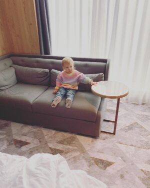 Ali Bastian Instagram - We got away for TWO WHOLE blissful nights!!! 10 minutes from where I grew up… When I was little, my parents had a difficult divorce and we weren’t in a financial position to go away on holl with my Mum for many years. One of my fondest memories growing up was her booking a night for us at the Holiday Inn as a treat… around the corner from where we lived!!…. So we could order room service, watch cartoons in bed and use the swimming pool like the two little water babies we were - and still are! We felt like lottery winners!! I now have a deeper understanding of the very real need my mum must have had for a change of scene and to mementarily simplify life with two small children. I’m so lucky that I have been able to travel in my adult life and dreamed of doing that with my new little family in tow… but with Covid lockdowns and learning how to keep my little one safe with multiple food allergies, it was something that started to feel so out of reach… then I remembered my Mum packing us up in the car for our ‘mini-adventure’ and I thought… I can do this! Like a little homing pigeon, I drove us all back to my home town. We packed a car full of safe foods and asked the hotel to empty the mini-bar to keep our food cold. We snuck in a toaster! If all else failed, there would always be tea and toast! We had hotel room picnics, swam like little fish and fed the ducks their peas and sweet corn. I feel recharged. It was a huge win for us as a family and a change was definitely a good rest! 💞