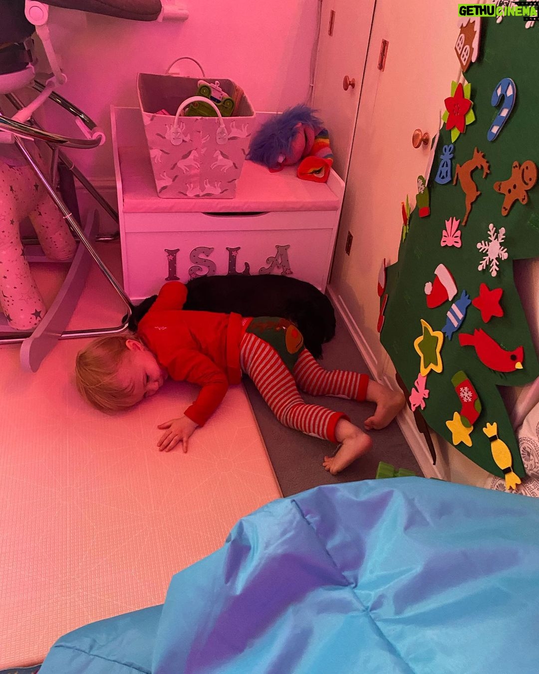 Ali Bastian - 1.1K Likes - Christmas Photo Dump!!! 🎄🎄🎄 We felt so incredibly lucky to be able to share Christmas with my family given the absolute hellish lottery of the Covid situation at the moment. D had one day off Panto so Christmas Day was just the three of us…. With my fam popping in and out the rest of the time and a lovely late night doorstep visit from my in-laws. ❤️
📸 1.Christmas Eve game starting strong.
2. My mum upping the Xmas ante by putting my child in a stocking.
3. Bella (my Mum’s dog) and Isla were inseparable. 4. Christmas Morning… my little early riser discovering her new kitchen! She makes a mean ‘cup of cino’ ☕️. 5. Getting a full Xmas dinner out of the oven by 12 so we could all eat together on Isla’s schedule meant we were all still in our pyjamas and no chance to run a brush through my hair or so much as stick on an eyeliner. It was chaos … but it was our chaos ❤️
6. … just because ❤️ . 7. Boxing Day … finally got some make up on and an ‘out fit’… David bought me a mini ring flash and I was trying to look cute… but just managed to look a bit dead eyed and weird 😂. 8. First time we ventured out of the house after living like hamsters for three days 🐹😂. 9. I LOVE this pic that my mum took and sent to me… I didn’t know it existed. It’s quite emotional to see myself looking so happy and relaxed. Isla has multiple allergies and weaning was a white knuckle ride. For a long time just setting foot in the kitchen I was on absolute red alert. This captures my baby enjoying her food and the simple joy that brings. It makes me realise how far we have come.
10. Merry Christmas ❤️🎄🌟