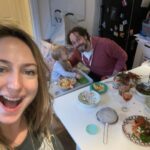 Ali Bastian Instagram - Christmas Photo Dump!!! 🎄🎄🎄 We felt so incredibly lucky to be able to share Christmas with my family given the absolute hellish lottery of the Covid situation at the moment. D had one day off Panto so Christmas Day was just the three of us…. With my fam popping in and out the rest of the time and a lovely late night doorstep visit from my in-laws. ❤️ 📸 1.Christmas Eve game starting strong. 2. My mum upping the Xmas ante by putting my child in a stocking. 3. Bella (my Mum’s dog) and Isla were inseparable. 4. Christmas Morning… my little early riser discovering her new kitchen! She makes a mean ‘cup of cino’ ☕️. 5. Getting a full Xmas dinner out of the oven by 12 so we could all eat together on Isla’s schedule meant we were all still in our pyjamas and no chance to run a brush through my hair or so much as stick on an eyeliner. It was chaos … but it was our chaos ❤️ 6. … just because ❤️ . 7. Boxing Day … finally got some make up on and an ‘out fit’… David bought me a mini ring flash and I was trying to look cute… but just managed to look a bit dead eyed and weird 😂. 8. First time we ventured out of the house after living like hamsters for three days 🐹😂. 9. I LOVE this pic that my mum took and sent to me… I didn’t know it existed. It’s quite emotional to see myself looking so happy and relaxed. Isla has multiple allergies and weaning was a white knuckle ride. For a long time just setting foot in the kitchen I was on absolute red alert. This captures my baby enjoying her food and the simple joy that brings. It makes me realise how far we have come. 10. Merry Christmas ❤️🎄🌟