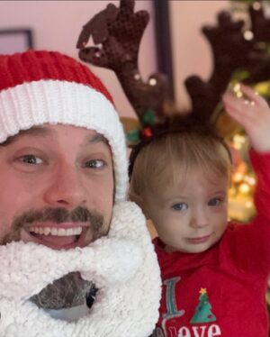 Ali Bastian Instagram - Christmas Photo Dump!!! 🎄🎄🎄 We felt so incredibly lucky to be able to share Christmas with my family given the absolute hellish lottery of the Covid situation at the moment. D had one day off Panto so Christmas Day was just the three of us…. With my fam popping in and out the rest of the time and a lovely late night doorstep visit from my in-laws. ❤️ 
📸 1.Christmas Eve game starting strong.
2. My mum upping the Xmas ante by putting my child in a stocking.
3. Bella (my Mum’s dog) and Isla were inseparable.  4. Christmas Morning… my little early riser discovering her new kitchen!  She makes a mean ‘cup of cino’ ☕️. 5. Getting a full Xmas dinner out of the oven by 12 so we could all eat together on Isla’s schedule meant we were all still in our pyjamas and no chance to run a brush through my hair or so much as stick on an eyeliner. It was chaos … but it was our chaos ❤️ 
6. … just because ❤️ .  7. Boxing Day … finally got some make up on and an ‘out fit’… David bought me a mini ring flash and I was trying to look cute… but just managed to look a bit dead eyed and weird 😂. 8. First time we ventured out of the house after living like hamsters for three days 🐹😂. 9. I LOVE this pic that my mum took and sent to me… I didn’t know it existed. It’s quite emotional to see myself looking so happy and relaxed. Isla has multiple allergies and weaning was a white knuckle ride. For a long time just setting foot in the kitchen I was on absolute red alert. This captures my baby enjoying her food and the simple joy that brings. It makes me realise how far we have come.
10. Merry Christmas ❤️🎄🌟