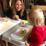 Ali Bastian Instagram - Christmas Photo Dump!!! 🎄🎄🎄 We felt so incredibly lucky to be able to share Christmas with my family given the absolute hellish lottery of the Covid situation at the moment. D had one day off Panto so Christmas Day was just the three of us…. With my fam popping in and out the rest of the time and a lovely late night doorstep visit from my in-laws. ❤️ 📸 1.Christmas Eve game starting strong. 2. My mum upping the Xmas ante by putting my child in a stocking. 3. Bella (my Mum’s dog) and Isla were inseparable. 4. Christmas Morning… my little early riser discovering her new kitchen! She makes a mean ‘cup of cino’ ☕️. 5. Getting a full Xmas dinner out of the oven by 12 so we could all eat together on Isla’s schedule meant we were all still in our pyjamas and no chance to run a brush through my hair or so much as stick on an eyeliner. It was chaos … but it was our chaos ❤️ 6. … just because ❤️ . 7. Boxing Day … finally got some make up on and an ‘out fit’… David bought me a mini ring flash and I was trying to look cute… but just managed to look a bit dead eyed and weird 😂. 8. First time we ventured out of the house after living like hamsters for three days 🐹😂. 9. I LOVE this pic that my mum took and sent to me… I didn’t know it existed. It’s quite emotional to see myself looking so happy and relaxed. Isla has multiple allergies and weaning was a white knuckle ride. For a long time just setting foot in the kitchen I was on absolute red alert. This captures my baby enjoying her food and the simple joy that brings. It makes me realise how far we have come. 10. Merry Christmas ❤️🎄🌟
