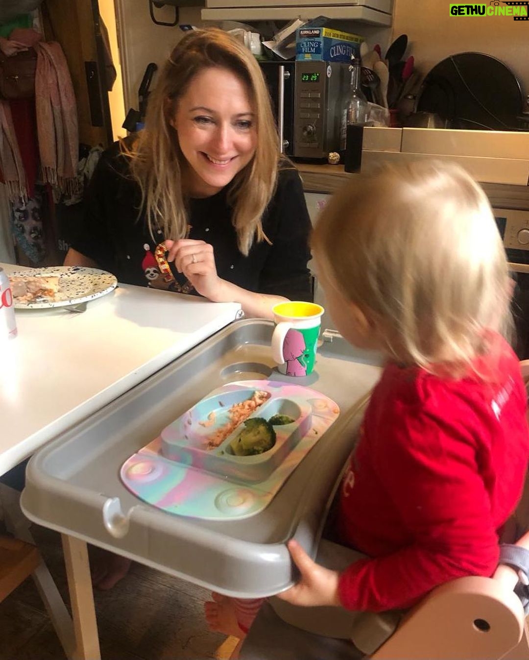 Ali Bastian - 1.1K Likes - Christmas Photo Dump!!! 🎄🎄🎄 We felt so incredibly lucky to be able to share Christmas with my family given the absolute hellish lottery of the Covid situation at the moment. D had one day off Panto so Christmas Day was just the three of us…. With my fam popping in and out the rest of the time and a lovely late night doorstep visit from my in-laws. ❤️
📸 1.Christmas Eve game starting strong.
2. My mum upping the Xmas ante by putting my child in a stocking.
3. Bella (my Mum’s dog) and Isla were inseparable. 4. Christmas Morning… my little early riser discovering her new kitchen! She makes a mean ‘cup of cino’ ☕️. 5. Getting a full Xmas dinner out of the oven by 12 so we could all eat together on Isla’s schedule meant we were all still in our pyjamas and no chance to run a brush through my hair or so much as stick on an eyeliner. It was chaos … but it was our chaos ❤️
6. … just because ❤️ . 7. Boxing Day … finally got some make up on and an ‘out fit’… David bought me a mini ring flash and I was trying to look cute… but just managed to look a bit dead eyed and weird 😂. 8. First time we ventured out of the house after living like hamsters for three days 🐹😂. 9. I LOVE this pic that my mum took and sent to me… I didn’t know it existed. It’s quite emotional to see myself looking so happy and relaxed. Isla has multiple allergies and weaning was a white knuckle ride. For a long time just setting foot in the kitchen I was on absolute red alert. This captures my baby enjoying her food and the simple joy that brings. It makes me realise how far we have come.
10. Merry Christmas ❤️🎄🌟