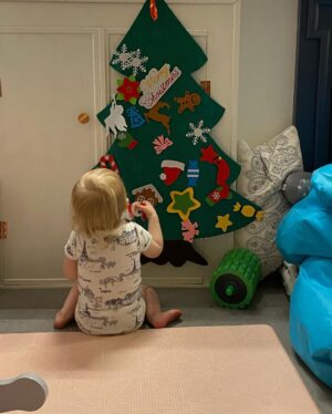 Ali Bastian Instagram - Christmas Photo Dump!!! 🎄🎄🎄 We felt so incredibly lucky to be able to share Christmas with my family given the absolute hellish lottery of the Covid situation at the moment. D had one day off Panto so Christmas Day was just the three of us…. With my fam popping in and out the rest of the time and a lovely late night doorstep visit from my in-laws. ❤️ 
📸 1.Christmas Eve game starting strong.
2. My mum upping the Xmas ante by putting my child in a stocking.
3. Bella (my Mum’s dog) and Isla were inseparable.  4. Christmas Morning… my little early riser discovering her new kitchen!  She makes a mean ‘cup of cino’ ☕️. 5. Getting a full Xmas dinner out of the oven by 12 so we could all eat together on Isla’s schedule meant we were all still in our pyjamas and no chance to run a brush through my hair or so much as stick on an eyeliner. It was chaos … but it was our chaos ❤️ 
6. … just because ❤️ .  7. Boxing Day … finally got some make up on and an ‘out fit’… David bought me a mini ring flash and I was trying to look cute… but just managed to look a bit dead eyed and weird 😂. 8. First time we ventured out of the house after living like hamsters for three days 🐹😂. 9. I LOVE this pic that my mum took and sent to me… I didn’t know it existed. It’s quite emotional to see myself looking so happy and relaxed. Isla has multiple allergies and weaning was a white knuckle ride. For a long time just setting foot in the kitchen I was on absolute red alert. This captures my baby enjoying her food and the simple joy that brings. It makes me realise how far we have come.
10. Merry Christmas ❤️🎄🌟