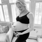 Ali Bastian Instagram – Happy NY 🍾 Hope you all have a lovely evening whatever you are planning. We are very much in hibernation mode and fairly sure I won’t be awake at midnight 🤣… In my 34th week now…. Eeeeek!! It’s flying. Cannot wait to meet you baby girl 💖 (but WILL wait another few weeks, so you can please stay just where you are for now!) Still feel like I have so much preparation to do and all I want to do is sleep and eat 🤣 Wish you all the love, luck and happiness in the world for ‘23 💖  Super supportive nursing bra: @marksandspencer  Most comfortable maternity leggings in the world: @natalactive @mumandme_app #mumbrand #gift #thankyou #thirdtrimester