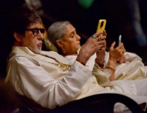 Amitabh Bachchan Instagram - Parents at work on shooting set .. as lights camera get ready 😂😂😂🤣 favourite pastime