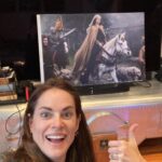 Amy Bailey Instagram - HOUSEGUEST ETIQUETTE 🏠 After staying at a friend’s house, it is considered good manners to leave a little memento behind. Just a small token of appreciation so they can see it now and again and think fondly of you. So I put a giant poster of myself in front of @clivestanden’s TV. You’re welcome buddy! Enjoy!