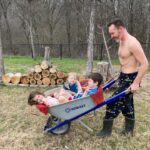 Amy Bailey Instagram - Topless husband in pac-man pjs Workin the land With a barrow-full of offspring. Pure poetry. #MeetYouInTheBedchamber @miniateam