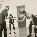 Amy Bailey Instagram - Back when dinosaurs roamed the earth, my husband @miniateam and I met in a ballet company. We were best friends immediately. For our second performance season the legendary @mradamrcooper chose us to choreograph his new piece on. (You made us feel like the coolest kids on the block Adam!). It was a gorgeous pas de deux called “Elegy for Two”. Lots of push pull angsty gutsy moves and we rolled around on the floor together a lot. Anthony and I spent the summer touring England with this piece and needless to say, by the end of that summer, we were IN LOVE 😬😍. We eloped by September, thinking everyone would be so surprised, but the reaction was mostly “Ugh you guys finally GOT A ROOM”. I came across these Elegy rehearsal photos today and was swept away in memories. What a time, what a time. 💫