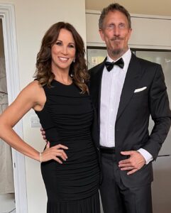 Andrea McLean Instagram - Tonight we are ‘out out’! Some ‘before we left the house’ pictures taken by @makeupcouk who is wholly responsible for making me look so glam. Thank you to @boodles for the jewellery tonight. Very impressed by Mr F in a dickie bow. 🥰 #wcw23 (And yes, that is an Elf fridge magnet behind us. Because Elf isn’t just for Christmas… 😁)