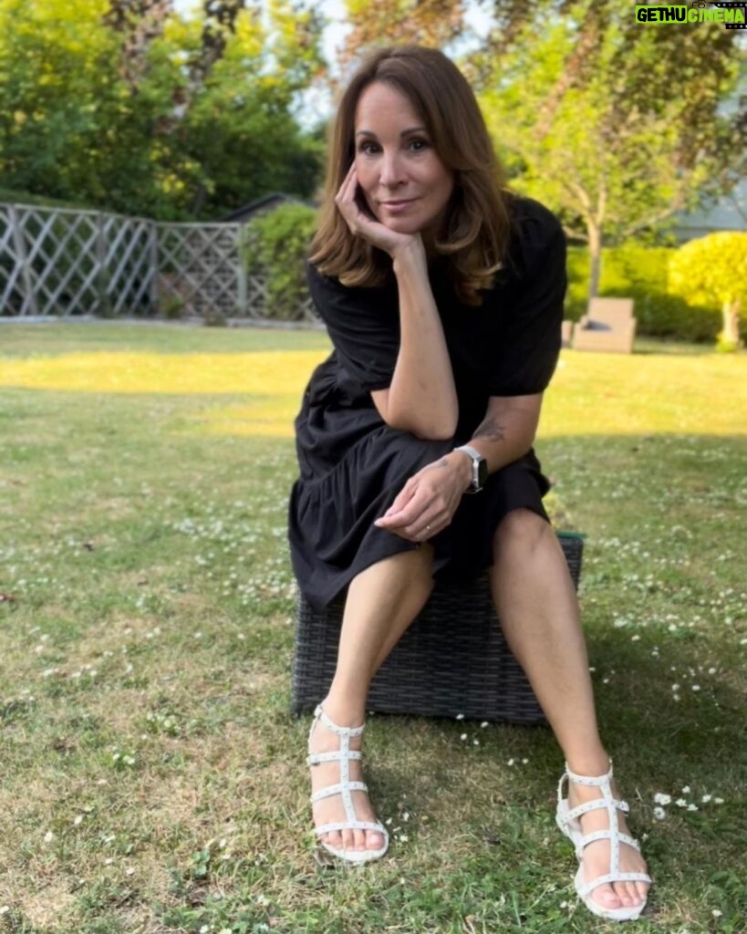 Andrea McLean Instagram - Why I like wearing black in summer… I know it’s not exactly bright and breezy, but it’s still my go-to. I realised this as the past two weeks have been super scorchio, and yet 80% of what I wear is still black with pops of colour. Why? 🙂I feel comfy in it. 🤩I feel classy in it. 😎I can stick heels on and feel dressed up or sliders and feel dressed down. 🙌I can wear the same thing from day to night. 😊I still feel like ‘me’. 👀I don’t have to wear a bra when it’s really hot and no one knows… These two dresses are case in point and have become my summer faves this heatwave. They’re from @nextofficial and I love them. #summer #hot #whatilike #next #fashion #gifted