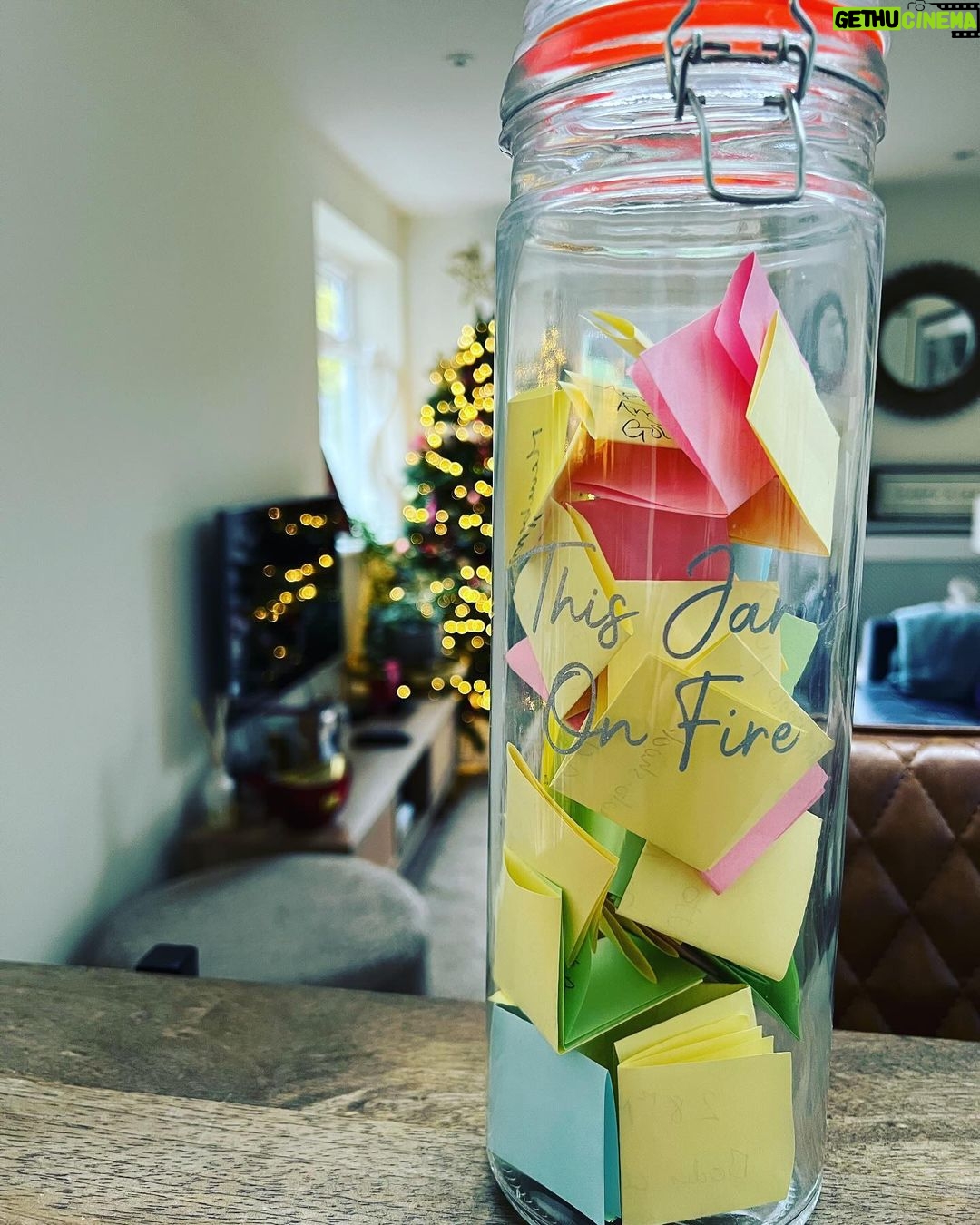 Andrea McLean Instagram - This jar is one of our most treasured possessions, and the fact that it is full feels miraculous. My sister started us on the tradition of writing down on coloured paper every little win we have as a family throughout the year. It doesn’t matter how small it may seem to anyone else, our motto is: “If it matters to you, it matters to us”, so we write it down and pop it in. A few years ago, my wonderful This Girl Is On Fire community joined together to present me with this jar, and they filled it with all the positive changes they had seen themselves since joining me. To be honest, I cried my eyes out when I got it because it meant so much, and seeing this jar sitting in my kitchen waiting to be filled at the start of each year, knowing they gave it to me and had such faith in me, is a huge motivator for keeping going when things are tough. This year has been one of our most challenging yet as a family; and it touched all of us, in every part our lives. We are not where we thought we would be. The big, bold audacious goals we made over a year ago are nowhere to be seen… And yet. We survived. I am healthy and well. Our family is well. We made new plans and discovered new paths, and we are walking along those ones now. We love each other and are loved in return. Our jar of little wins will be emptied today, and we will read them and remind ourselves of everything good that happened and the progress we made. I will collect them all and keep them in an envelope marked “2023 Jar” and put them with the others. And tomorrow we start again. Happy New Year to you, and may your 2024 jar be full. #newyear