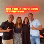 Andrea McLean Instagram - 4 things I did this week to fill my cup that had nothing to do with work: 1. Had a great catch up with @simonalexandero and @iamlauriewang in London. I loved the neon sign - and as someone who has recently moved back to the Big Smoke, it certainly felt apt! 2. Mum and I went out to lunch while Nick and Dad went to watch grown men chase little white balls around at Wentworth. It’s become a bit of an annual traction now for us all, and it’s lovely to have the excuse to go out, just the two of us. 3. Got up early on Saturday morning and took @teddymcfeen for a dog walk with Nick and @james_stew and little Milo. 4. We headed up to Leeds to support Nik and Eva @thespeakmans and their wonderful charity @traumaresearchuk helping people recover from the symptoms of trauma, panic, PTSD and anxiety. My gorgeous dress was #gifted to me by Leeds designer Rebecca Rhoades @rhoadesfashion I felt very glam - loved it! A very sociable week - what have you been up to? #4things