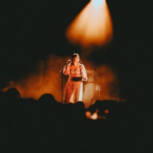 Angel Olsen Instagram - I still can’t believe it.  Hollywood Forever Cemetery was one of our biggest LA shows yet. Did you see the ghosts ? How about the five cats hanging out by the tombstones? Did you see Mel Blanc’s grave? 

Sometimes I can’t believe this is what I’m doing with my life - Thankyou for listening, singing my songs with me, making them come alive over and over again. 

🦚

Thank you to @kingtuffy for playing with us. Thank you to @burgers for the DJing. Thank you to @hwdforever for having us. 

Photo 1 by @maximludwig 
Photos 2-5 by @pentaxplayboi