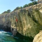 Angie Scarth-Johnson Instagram - Climbing + Water = perfect summer treat.🌊🐟🌞🤍🐋 my fear of sharks keeps me from falling. 🥲 @redbullau @climbing_anchors @thenorthface_aunz @tenayaclimbing @camp1889 @mytendon @cvok9c @climbersagainstcancerofficial @climbskinspain @frictionlabs #neverstopexploring #tenayaclimbing #climbinginspain #womanclimbers #climbskin #chalkupless #newstandardinchalk #climbinganchors #tenayaathlete