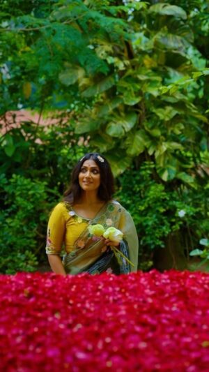Anindita Bose Instagram - Nothing holds back the excitement of getting Durga Maa’s first look as she reaches Mondop on Shoshti. Here we present a super comfortable light weight green ensemble, that has the imagery of entire family of Maa with her kids inimitably hand embroidered on the anchal & blouse. Also the lotus and lotus leaves cutout work on the border and on the body of the saree steals the look for your shoshti. Carry your style effortlessly while looking ethereal draped in this ensemble.

Gracing the Soshti look @aninditaa_bose 💛

#sayantighoshdesignerstudio #sayantighoshpujocollection2023 #festivecollection #festivewear #durgapuja2023 #maaasche #duggadugga