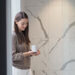 Anna Passey Instagram - My favourite shot from our latest @kipcandleco shoot for our newest release DRIFT- a refillable, pure essential oil candle, taken at the stunning @themunicipalhotelliverpool DRIFT is a blend created to help calm, focus and rebalance when you’re feeling overly busy-minded or a little ‘not quite yourself’ We have been working on it for the last year and a half, it brings a lot of value to me, and I hope it will do the same for others 🤍