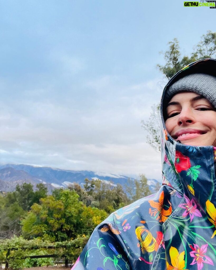 Anne Hathaway Instagram - Happy #EarthDay! Sent with love from inside my #secondhand raincoat! 🌈🌎🌍🌏🌈
