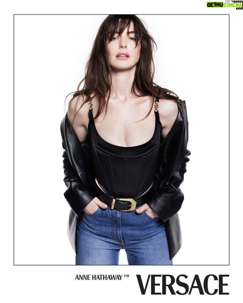Anne Hathaway Instagram - 🧷 #VersaceIcons campaign first images 🧷 When the brilliant and talented @donatella_versace approached me for this campaign, she shared her vision of a timeless collection with the trademark @versace edge. She said she wanted to focus on pieces designed to be a cherished part of one’s wardrobe, enjoyed outside the trend cycle, worn again and again throughout your life. I thought it was a fantastic idea, and I am so proud, grateful and thrilled to find myself newly included in the iconic @versace family. Now I’m gonna go enjoy these sexy jeans. 🧷⚡️👖🖤