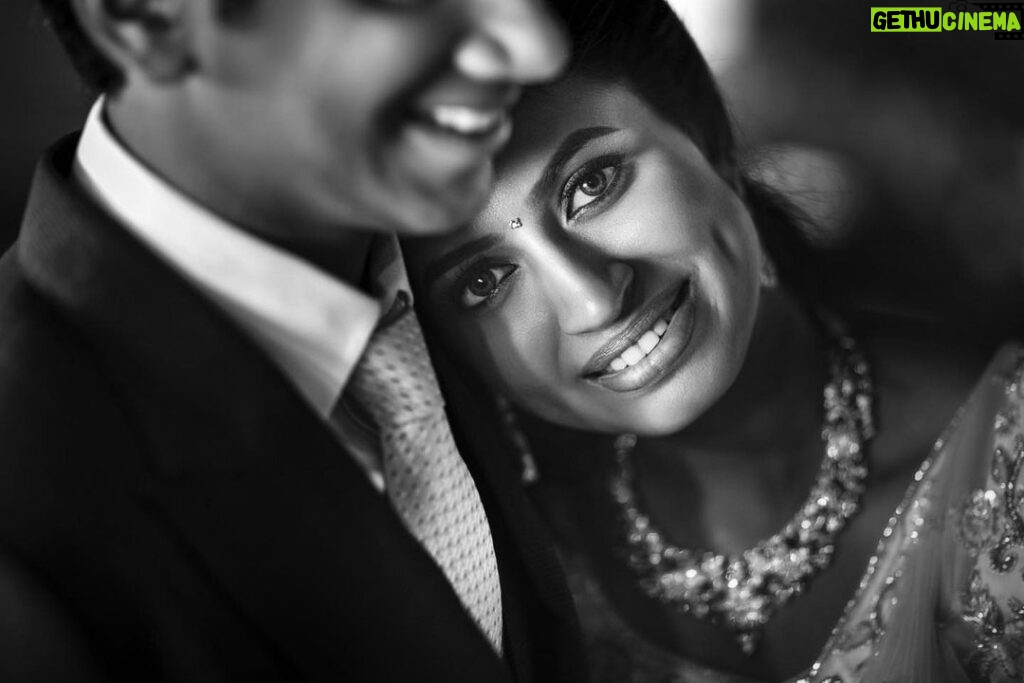 Arjun Kamath Instagram - Vasudaa and Harsan's wedding reception was a jolly affair, each passing minute marked by exuberance, colours, and laughter. As the busy day approached an end, we decided to make a few heartfelt portraits of the couple, away from the buzz of the celebrations. Slightly mellowed down by the chain of festivities, the newlyweds got the chance to catch a quiet breath in each other's company only when I began taking their candid photographs. That's when Vasudaa leaned in & rested her head on Harsan’s shoulder, as if stepping into a warm bubble of contentment. Watching this precious moment unfurl, I instantly brought in a light and made this beautiful portrait, as a warm smile lingered on our faces. In her eyes, I could see comfort and this rare feeling called "forever", and I'm glad I was able to freeze it into permanence. @harsan_raghu @vasudaa1611 Lit with a @profoto B10 @canonindia_official @srishtidigilife #weddingphotography #photography #bride #groom #wedding #indianwedding #arjunkamathphotography #blackandwhite #instagram #DoGreatWithCanon #MentorsInFocus #EOSMaestro Karur Town