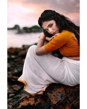 Arjun Kamath Instagram - Every day, as dawn made its way through the pink skies up above, she would gracefully walk to the shore of the sea. Here, hours would pass by as she whispered her deepest secrets to the waters. In return, they would always come back to embrace her in sheer frolic. As she watched the waters recede, she would imagine the waves to carry her secrets across the horizon, to a distant land she had never seen. And each time, before she started to leave, she would stand on the earthen rocks, gazing as far as her eyes permitted. In those fleeting moments, she would always wonder what awaited her beyond the waters. A voice in her head would softly tell her, “someone’s keeping your secrets safe over there.” And with this feeble faith in her heart, she would softly walk away, only to return the next morning.

Actor- @shriya.pilgaonkar 
Costume designed and styled by- @wardha_ahamed 
Make-up- @makeupartistkarishmabajaj 
Public Relations- @theitembomb 
Accessories- @creativegemsandjewels 

#CapturedOnCanon with a Canon EOS 5D Mark IV 

#portrait #actress #orange #sunrise #sky #rocks #water #photography #arjunkamathphotography #mumbai #instagood #instagram #DoGreatWithCanon #MentorsInFocus #EOSMaestro #shriyapilgaonkar