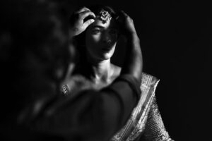 Arjun Kamath Instagram - It was dusk and the moon was just gathering its glimmer as it rose outside the window. The stars had taken over the sky, and were now twinkling to the mellow music that played in the room. Amidst this tranquil setting, there sat @anishadeevakonda , gracefully humming to the melodies as she prepared for the wedding ceremony. It was hard not to notice the sheer radiance that she was doused in, overshadowing all other plain movements around her. It was indeed a delight to click the otherwise jovial bride in such serene moments of stillness, suave, and contemplation.

#CapturedOnCanon with a Canon EOS 5D Mark IV + Canon EF 50mm f 1.2/L 

Lit with a couple of @profotoglobal B10’s at varying intensities 

#bride #makeup #gettingready #wedding #wedmegood #weddingphotography #blackandwhite #hyderabad #arjunkamathphotography 
#CapturedOnCanon #DoGreatWithCanon  #MentorsInFocus #srishtidigilife