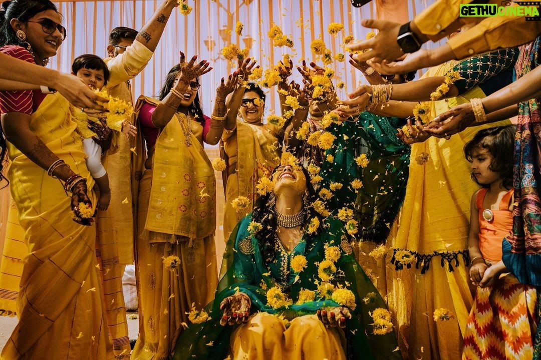 Arjun Kamath Instagram - Memories from a day when the sun came down to play with us. π Nidhi's glorious wedding ceremony was preceded by the most jovial and colourful haldi celebration. The morning was still young and fresh at the Heritage Khirasara Palace of Rajkot. The family was painted in a bright and inciting yellow for the haldi, bringing the scene to life with a riot of colours and celebration. As I walked the vibrant space, I was glad to observe the mirth that filled the air along with all the sparkle and gold. The ladies sang folk songs and danced in circles, the kids played catch in all their liveliness, and Nidhi, laced in grace and charm, was taking in each precious moment as felicity unfurled around her. To my delight, these pictures reflect the pure joy that filled the room that morning. Each moment bursted with colour and energy, and I was grateful to revel in its glory as I froze those precious emotions in time. Today, when I see these photographs, I can't help but transport myself back to that sprightly morning and feel the bliss I felt then all over again. Nidhi+Shirish, February 2022 #CapturedOnCanon with a @canonindia_official EOS R5 with a CanonRF 24-70 f/2.8 L USM #weddinng #weddingphotography #weddingphotographer #weddingflowers #haldiceremony #haldi #indianwedding #arjunkamathphotography #rajkot #DoGreatWithCanon #MentorsInFocus #EOSMaestro #instagood #instagram