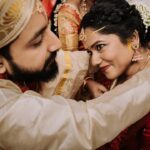 Arjun Kamath Instagram - Chaitra and Kunal’s wedding ceremony was straight out of a fairytale. The wedding dais was fragrant with elaborate designs of roses and jasmines, friends and family were blithely immersed in the celebration, and the ravishing couple were on cloud nine throughout the day. Sharing two of the many precious moments that I captured on their big day in the transcending green milieus of the Tamarind Tree, Bangalore. Their wedding brought all the serendipity to the artist in me, wrapped in shades of emerald green and the sparse warming silken reds, engulfed in laughter with a few tender moments of silence and grace. Chaitra + Kunal, December 2021 #CapturedOnCanon with a @canonindia_official EOS R5 and a CanonRF 24-70 f/2.8 L USM. Lit with the help of two @profoto B10’s at different intensities(diffused using soft boxes). @srishtidigilife @canonindia_official #weddingphotography #weddingphotographer #indianwedding #weddingdecoration #weddingphotos #bangalorewedding #bride #groom #mangalsutra #roses #jasmine #brideandgroom #bridalsarees #arjunkamathphotography #bangalore #DoGreatWithCanon #MentorsInFocus #EOSMaestro #instagood #instagram The Tamarind Tree
