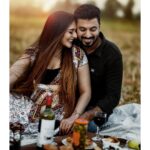 Arjun Kamath Instagram - The sun always shines brighter on two people who are in love. These heartwarming photos are a testament to that. It was one of those perfect autumn days marked by gratifying warmth and sheer joy. I had driven down to the outskirts of Bengaluru with Sharadh and Sharayu, and we were looking forward to clicking some memorable prewedding portraits. When the sun was still revelling in its evening glory, we found ourselves in a sprawling golden field far away from the traffic uproar and shiny concrete buildings. The balmy air enveloped us into a sweet melody as we enjoyed a cosy picnic, savouring wine with sweeter talks. Wrapped in the comfort of each other’s company, Sharadh and Sharayu enjoyed each passing moment with glee. Their faces shone with joy, and conversation followed seamlessly– one lovely anecdote after the other. It was indeed a delight to be in their company and click the couple in their true element, laughing and sharing tender moments of love with each other. It is times like these that remind me why I love telling stories through pictures. For me, there’s no joy greater than that of shared love. #CapturedOnCanon with a @canonindia_official EOS R5 with the Canon EF 100 mm f/2.8L Macro IS USM and a CanonRF 85mm f/1.2 L USM DS Makeup and hair by: @mjgorgeousmakeup #photoshootideas #preweddingshoot #trendingnow #couplegoals #preweddingphotography #indianphotography #prewedding #arjunkamathphotography #bangalore #bengaluru #sunset #evening #goldenhour #light #couple #bangaloreprewedding #romance #love #bangalorecouple #laughter #fields #wine #sunshine #sunflare #DoGreatWithCanon #MentorsInFocus #EOSMaestro #instagood #instagram @instagram @canonindia_official Bangalore, India