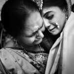 Arjun Kamath Instagram - Oh what an honour, to chronicle the purest love and all the emotions it brings. @shirish_p07 and @nidhi11_1991 ’s wedding ceremony was studded with all things glimmery and beautiful. A starry sky blessing the couple as they took pheras, a reverie of dance and music taking over the air, and the loved ones rejoicing galore. It was a true delight to be in the middle of all the celebration. Little did I know that the most heartwarming moments were yet to unfold. As the rituals approached an end, the moon rose further over our heads and it was time for the bride’s bidaai. Within a few moments, the air seemed to take a tender and poise turn as Nidhi began to bid her goodbyes. Pearly tears were followed by the most endearing smiles and words of love. And it was then that I took these photographs, that I feel encompass all the love that floated in the air. It is indeed a stroke of fortune that my work allows me to freeze such delicate, fleeting moments in time. It makes all the difference to the artist in me. #CapturedOnCanon with a @canonindia_official EOS R5 with a Canon RF 24-70mm F2.8 L Lens and lit with the help of @profoto B10’s diffused through a soft box. @srishtidigilife @canonindia_official @profoto #weddingphotos #weddingphotography #wedding #weddingday #indianwedding #love #bride #groom #bidaai #emotional #tears #mother #daughter #motherlove #weddingphotographer #blackandwhite #arjunkamathphotography #bangalore #DoGreatWithCanon #MentorsInFocus #EOSMaestro #instagood #instagram Heritage Khirasara Palace