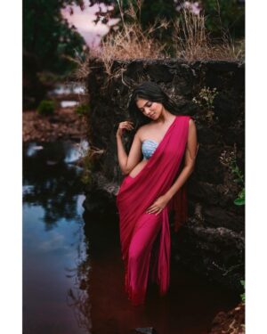 Arjun Kamath Instagram - There's a mystical land out there, where dusk is laced with whispers of magic and each new dawn comes with mesmerising reveries. In its most beautiful corner, you'll find her, gracefully engrossed in her own little world. Her eyes gleam with dreams from a place faraway and her lips hide spellbinding secrets. No one knows where she comes from, but they all still pin their hearts to her mystery and charm. That's how beauty is in this land—elusive but everlasting in memory, within reach but hard to attain.

Actress- @malavikamohanan_ 
Costume designed and styled by- @wardha_ahamed 
Make-up- @makeupartistkarishmabajaj 
Hair- @nishisingh_muah 
Public Relations- @theitembomb 
Accessories- @creativegemsandjewels 

#CapturedOnCanon with a Canon EOS 5D Mark IV @canonindia_official 

#portrait #actress #malavikamohanan #nature #green #pink #sunlight #sky #pond #water #rocks #photography #arjunkamathphotography  #DoGreatWithCanon #MentorsInFocus #EOSMaestro #malavikamohanan #bollywood #instagood #instagram